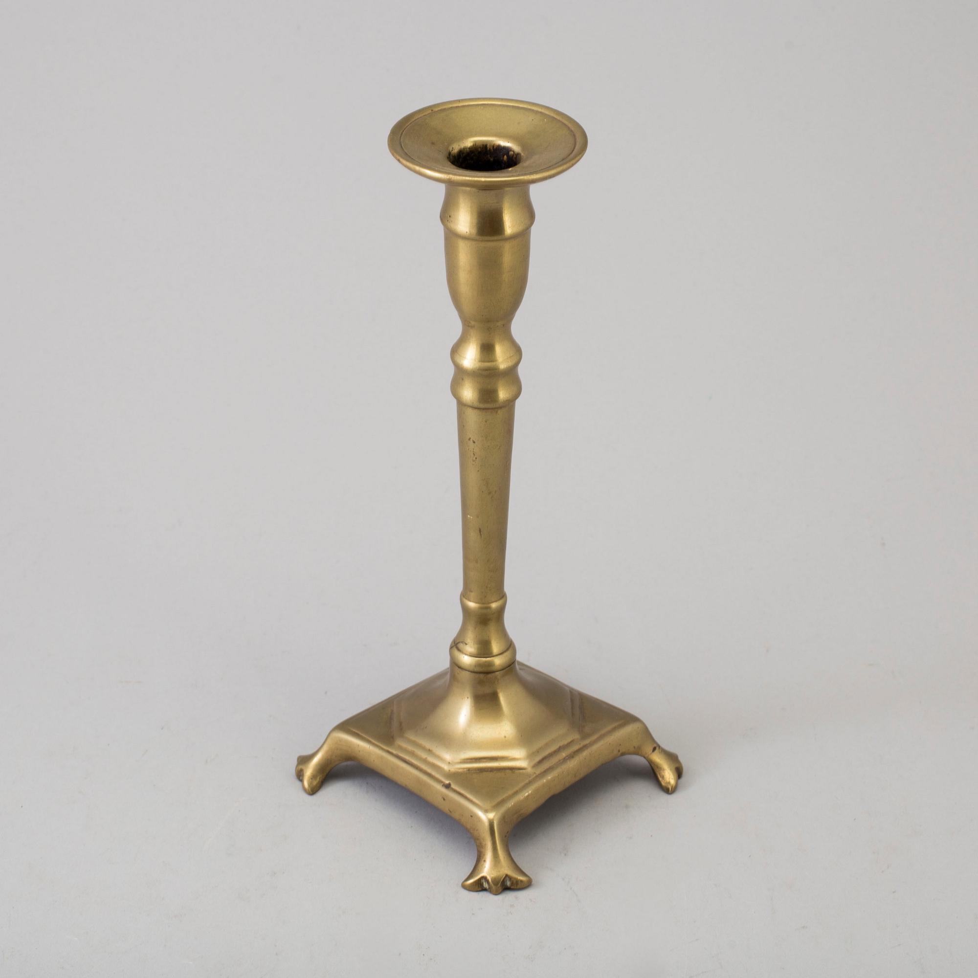 A BRONZE CANDLESTICK, 17th/18th century.