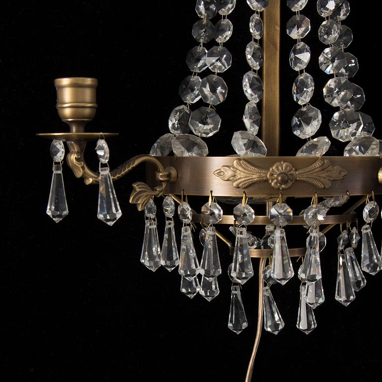 A pair of 20th century Gustavian style wall lights for two candles.