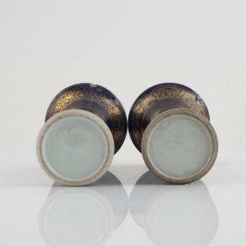 A pair of powder blue and gold 'trumpet' vases, Qing dynasty, 18th century.