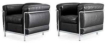 A pair of Le Corbusier 'LC 2' black leather and chromed steel easy chairs, Cassina, Italy.