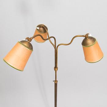 A brass floor lamp, mid-20th century.