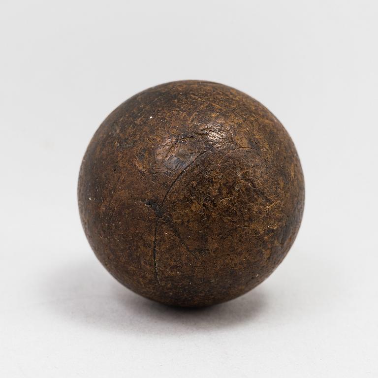 A gutta percha golf ball 19th century.