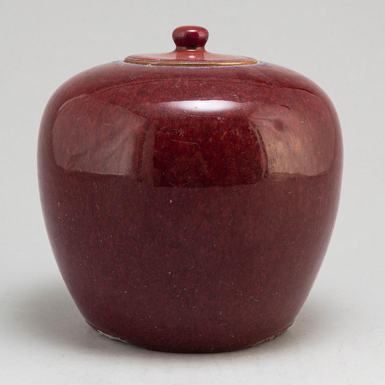 A sang de bouef jar with cover, Qing dynasty, circa 1900.