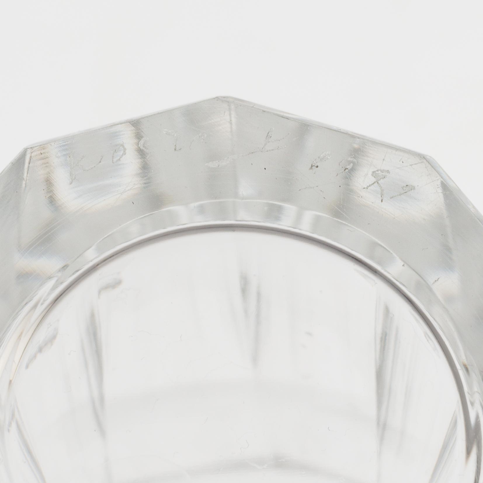 A set of twelve glasses and a cocktailshaker by Elis Berg, Kosta.