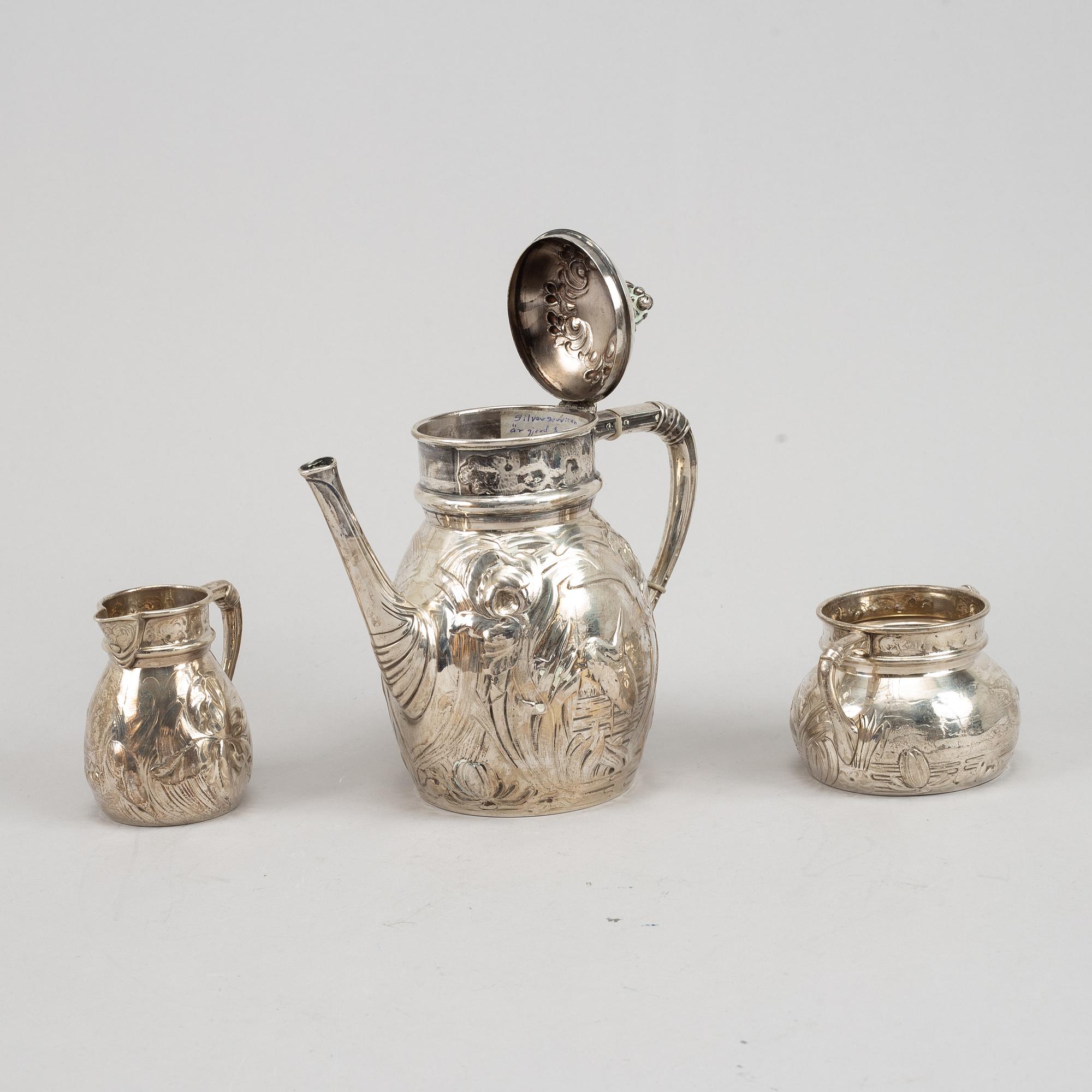 A Swedish silver coffee pot, creamer and sugar bowl, mark of Emil Oscar Möller, Malmö 1907.