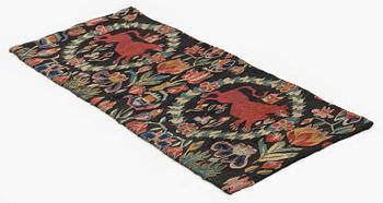 A cushion, 'Red Lion' (Rött Lejon), tapestry weave, ca 86 x 36 cm, southwestern Scania, first part of the 19th century.