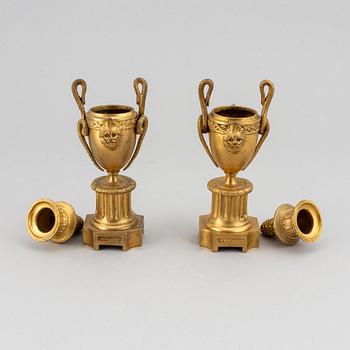 A pair of bronze empire style casolettes from around the year 1900.