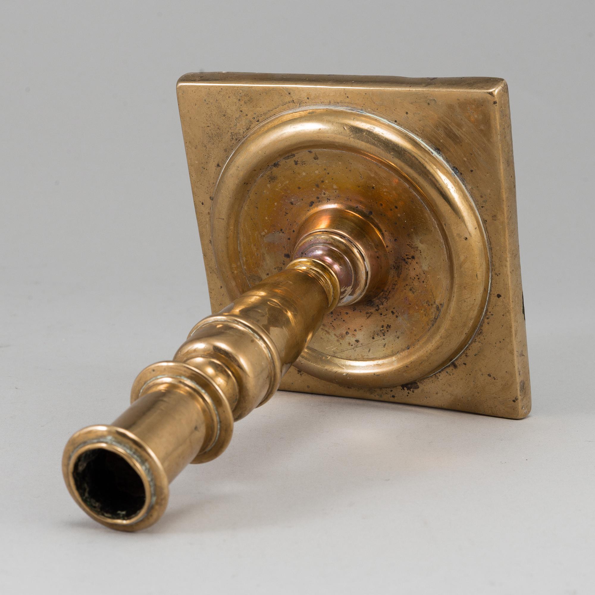 A 17th century bronze candlestick.
