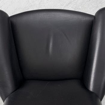 Hans J. Wegner, fåtölj med fotpall, "Ox Chair", EJ-100, Erik Jørgensen Møbelfabrik A/S, Svendborg, Danmark.