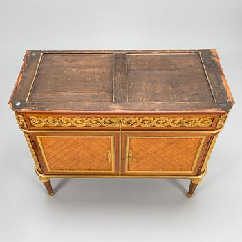 A French chest of drawer in Louis XVI style after Jean-Francois Leleu's school, late 19th century.