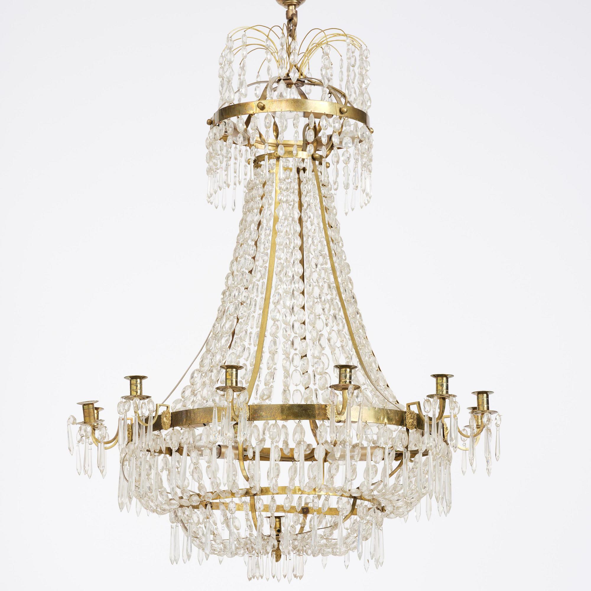 A Swedish gilt brass and cut glass thirteen-light Empire chandelier, early 19th century.