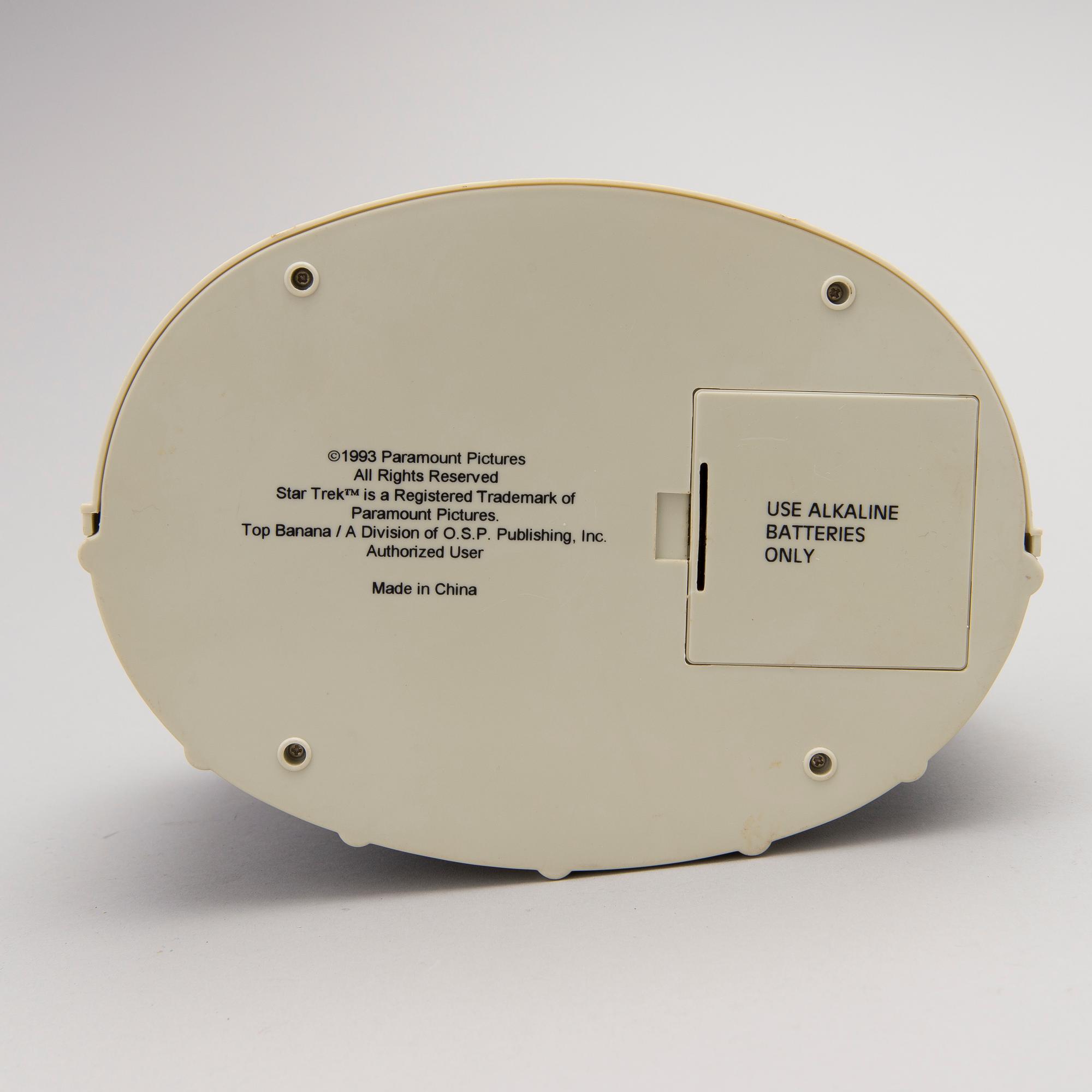 Three Vintage Toy Robots and a Table Clock.