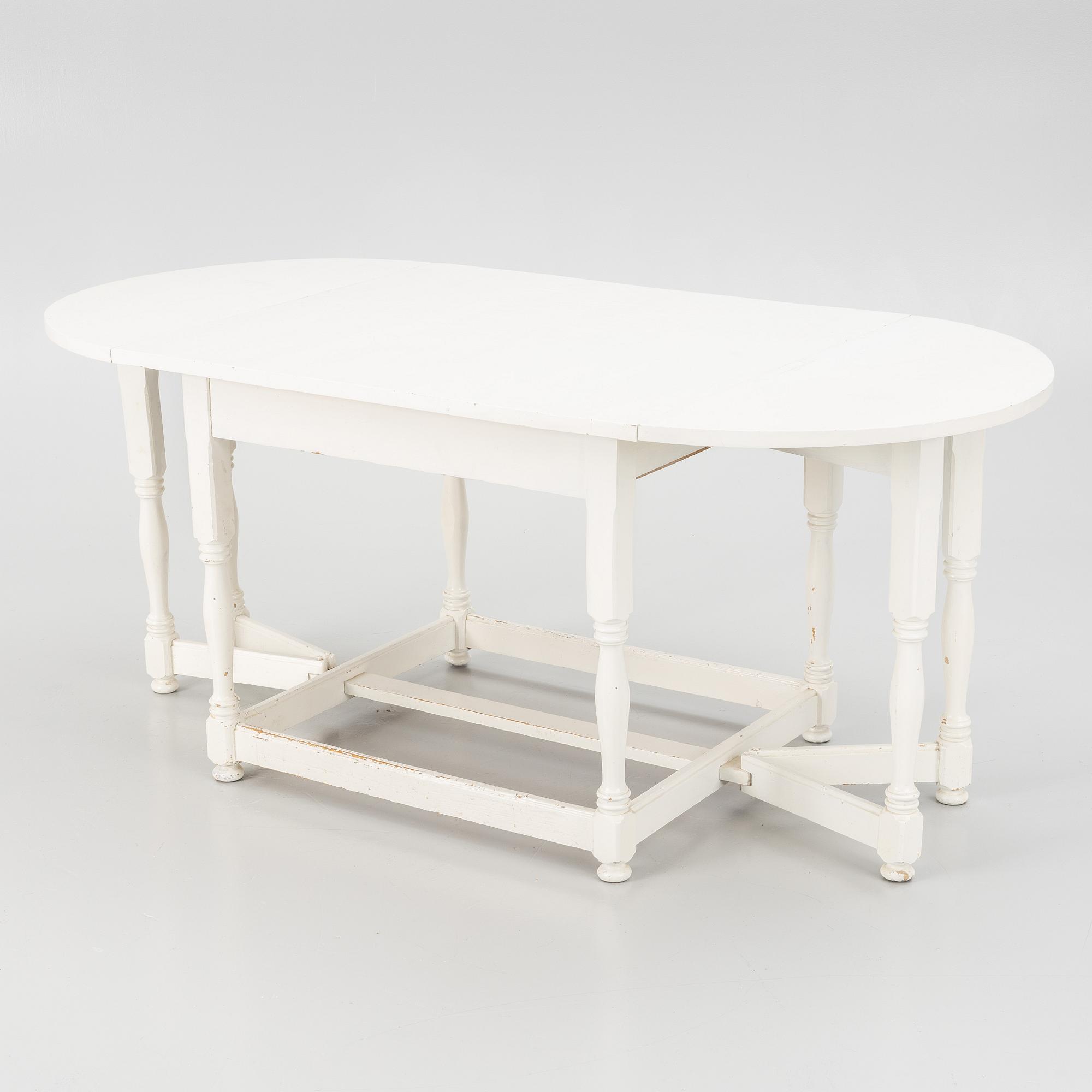 An early 20th century drop-leaf table.