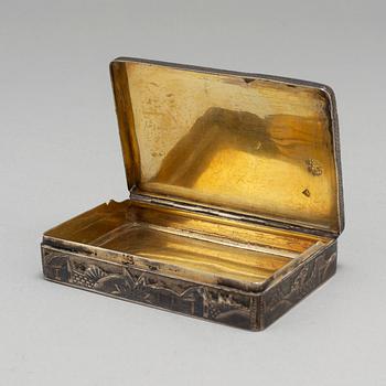 A Russian mid 19th century silver-gilt and niello snuff-box, mark of Moscow.