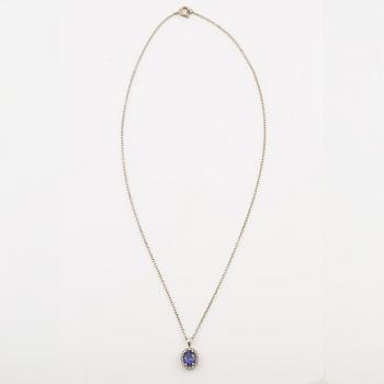 Pendant in 14K white gold set with a faceted tanzanite and round brilliant-cut diamonds.