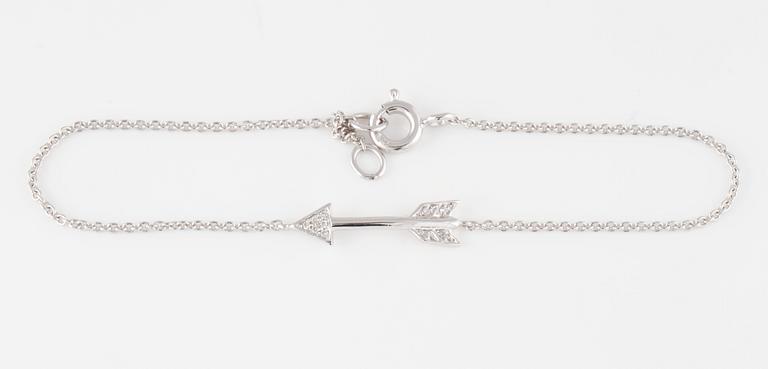 ARMBAND, 18K vitguld med briljantslipade diamanter ca 0.03 ct. Vikt 1,4 gram.