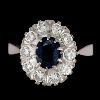 A blue sapphire and brilliant cut diamond ring, tot. app. 0.70 cts.