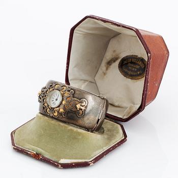 Silver bangle with watch.