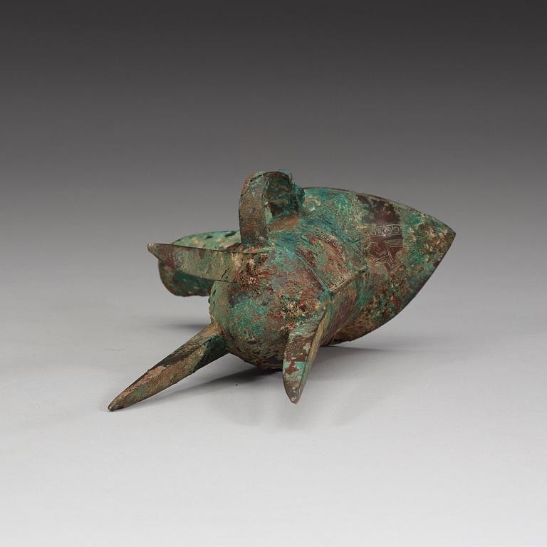 An archaic bronze ritual libation vessel (Jue), presumably Shang dynasty (1600-1046 BC).