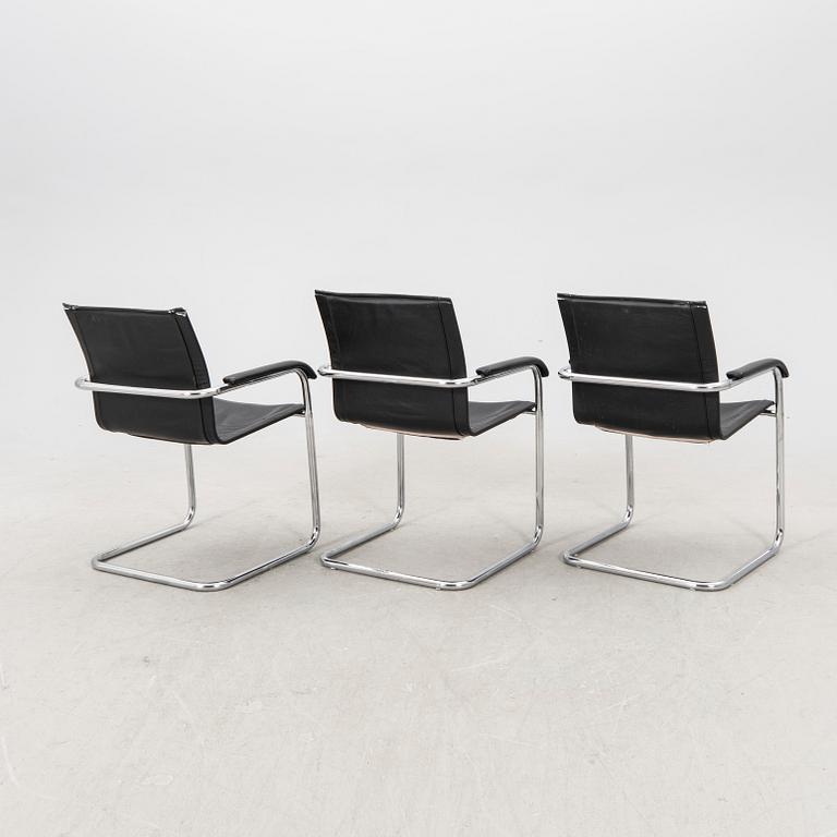 A set of five chrome and leather armchairs alter part of the 20th century.