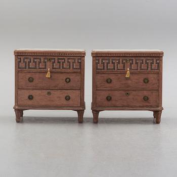 A pair of Gustavian style painted chest of drawers.