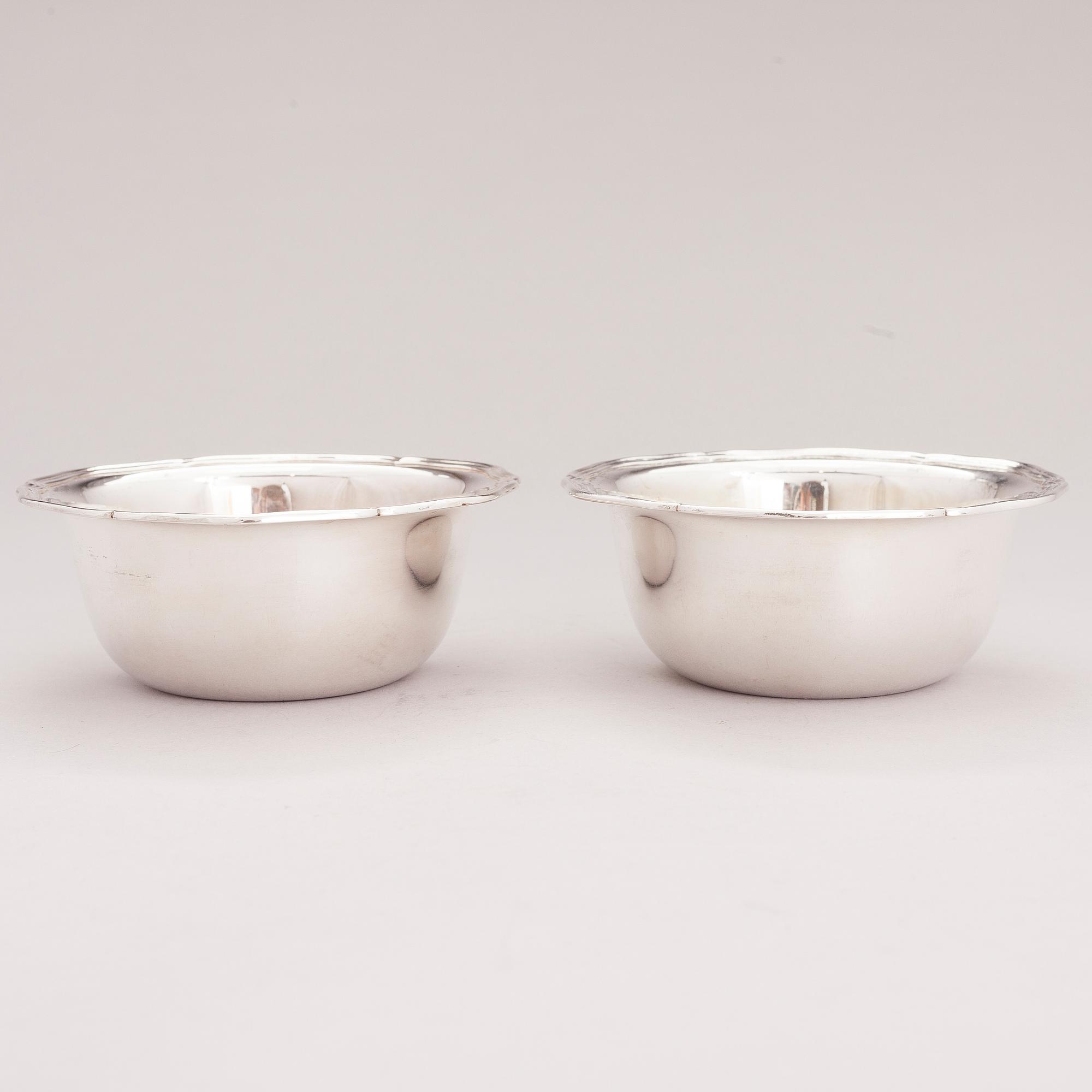 A lidded silver sugar bowl and a set of six silver bowls, Germany.