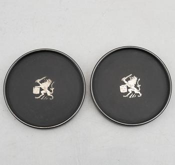 Coasters, 8 st, isolit med silverinläggningar, 1937-53.