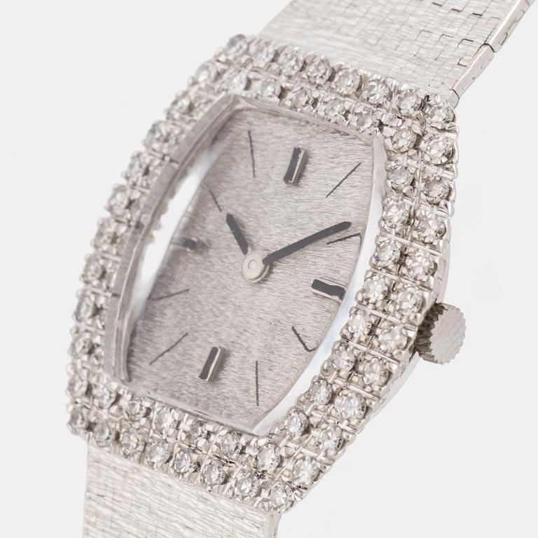 An 18K white gold and eight cut diamond Venus ladies watch.