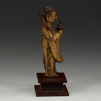 A gilt bronze figure of Longnü, Ming Dynasty, 17th century.