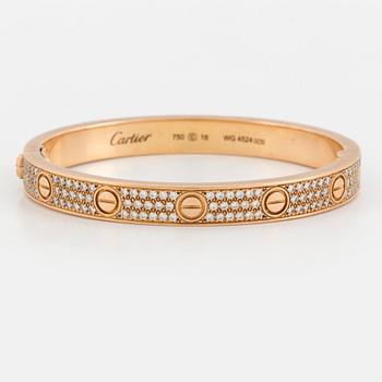 A Cartier 'LOVE' bangle set with round, brilliant-cut diamonds.