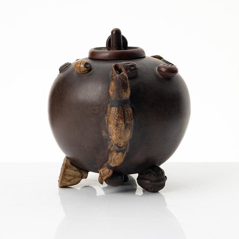 A Chinese 'hundred-fruit' yixing teapot, Qing dynasty (1644-1912).