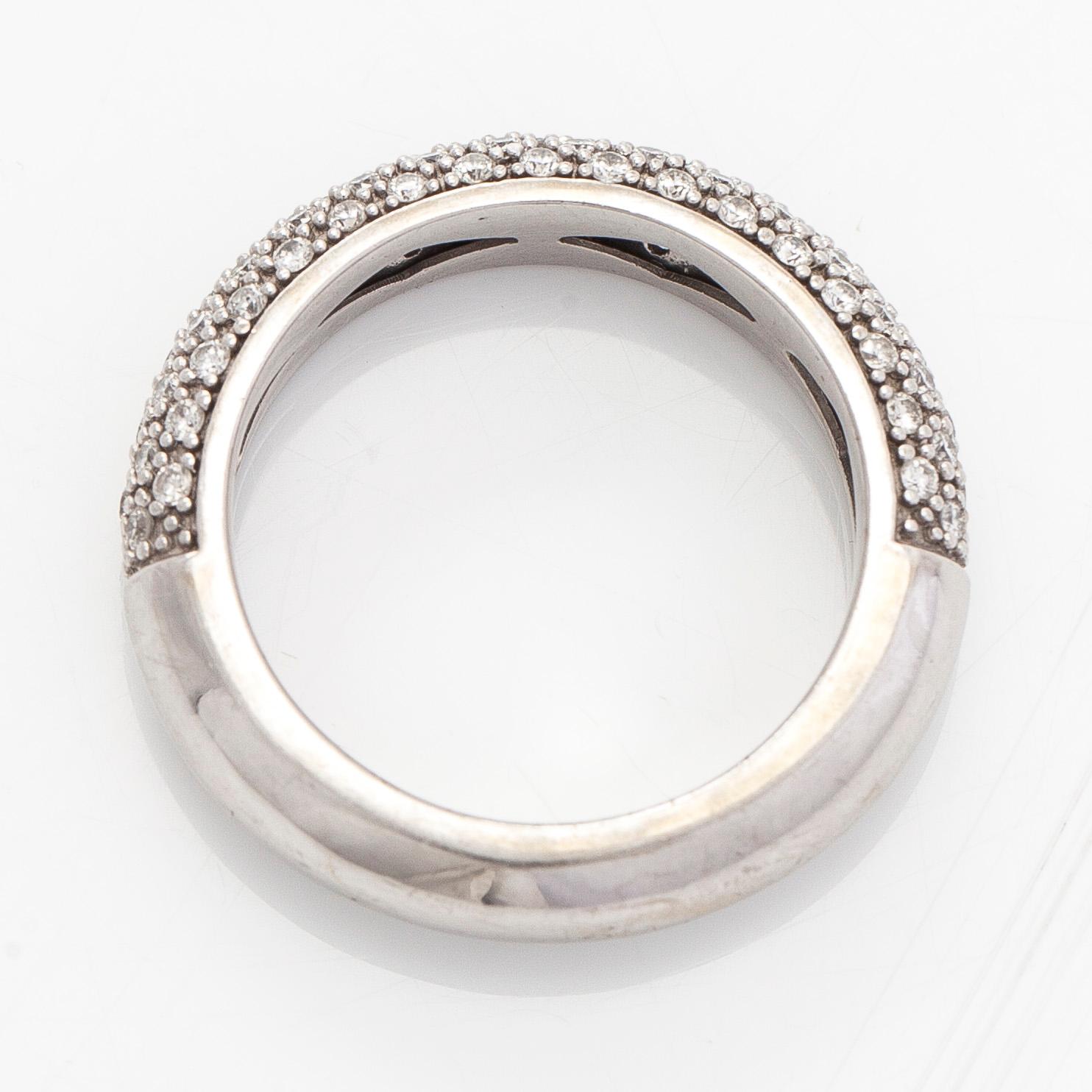 A 14K white gold ring with diamonds.