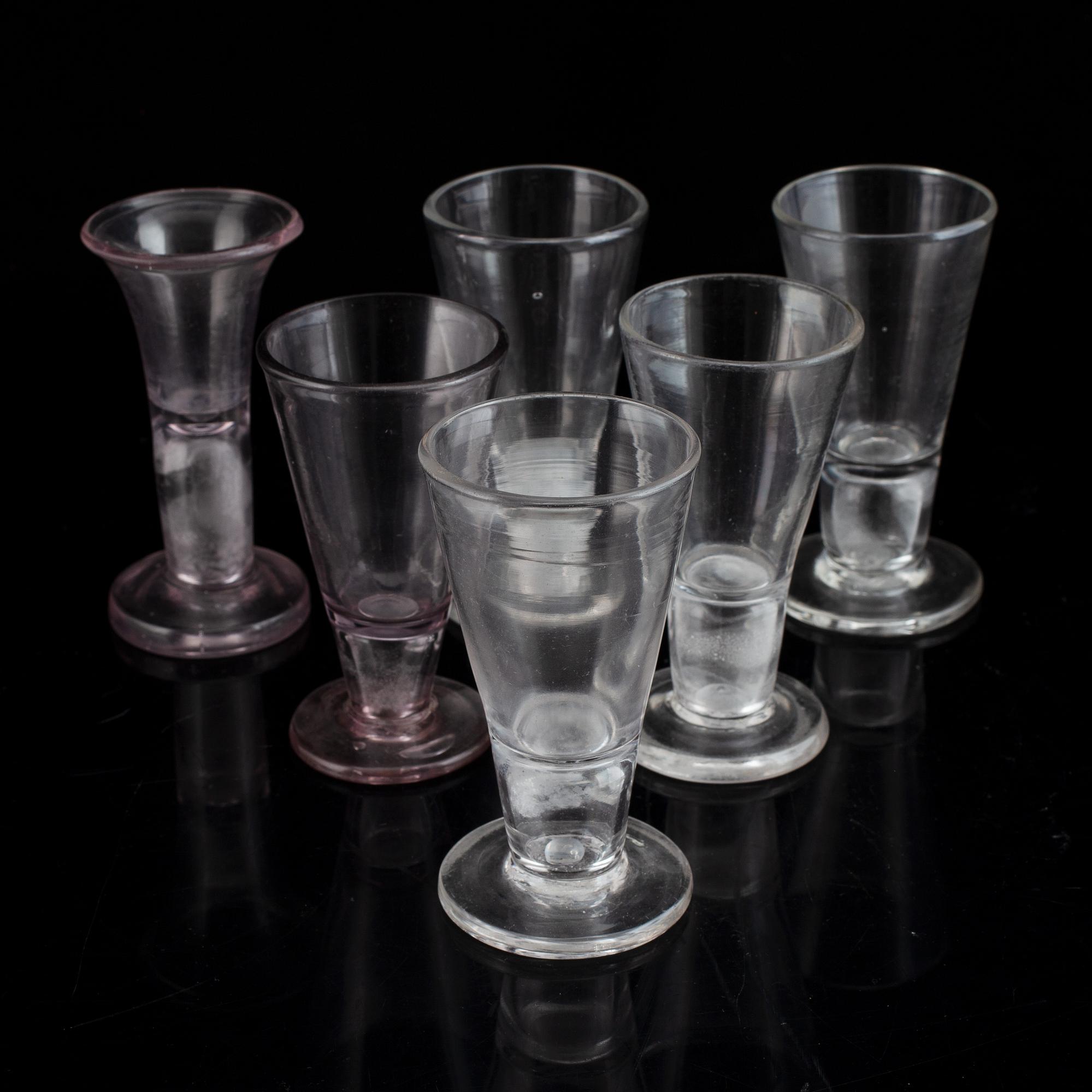 Six similar 18th century wine glasses.