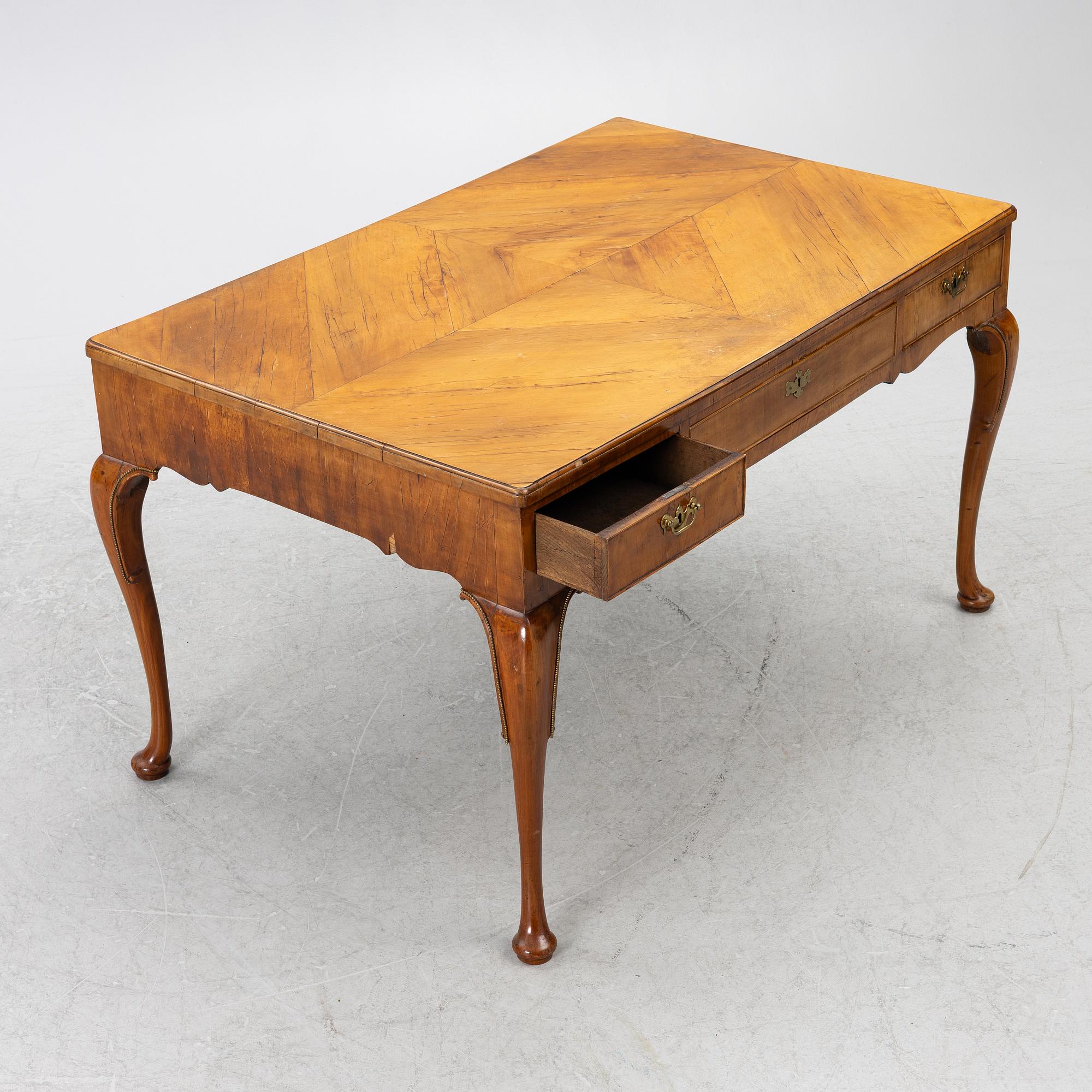 A George II walnut partner's desk, mid 18th century.