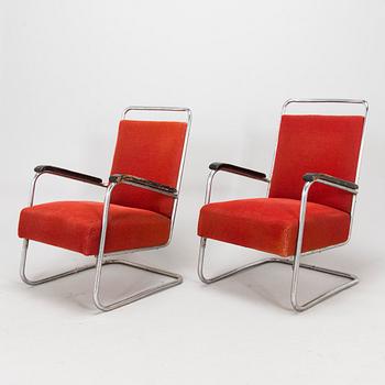 A pair of 1930s armchairs.