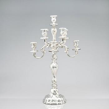 A pair of eight-light Louis XV-style silver candelabra, mark of Hermann Julius Wilm, Berlin, circa 1900.