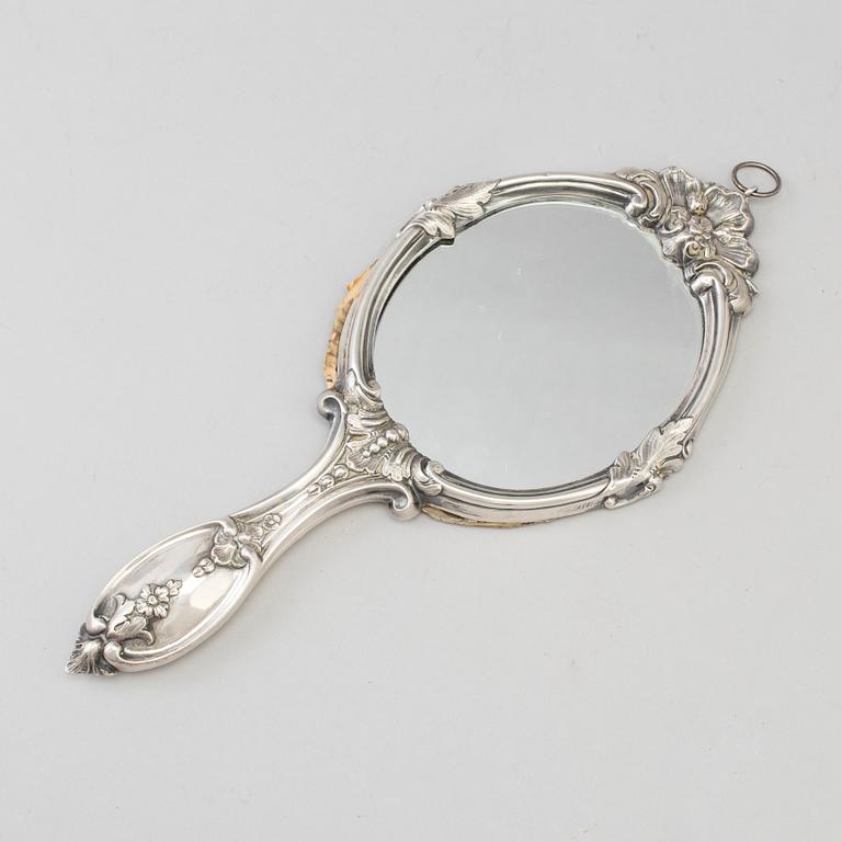 A silver hand mirror, Stockholm 1864.