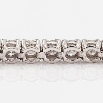 Tenniskaulakoru/-rannekoru, 14K valkokultaa ja timantteja n. 6.96 ct yht. AIG todistuksella.