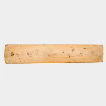 A Swedish folk art mangle board with carved decorationd, owners' initials and the date 1744.
