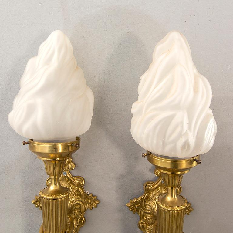 A pair of wall lamps later part of the 20th century.