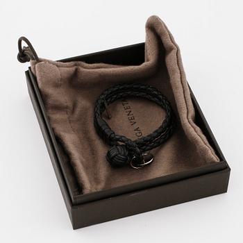 A bracelet by Bottega Veneta.