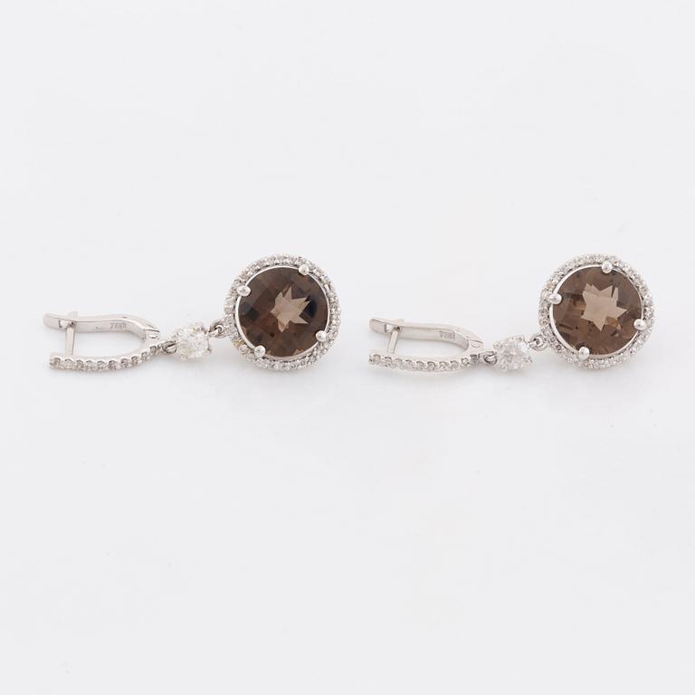 Smoky quartz and brilliant cut diamond earrings.