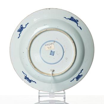 A blue and white 'reverse decorated' serving dish, Qing dynasty, Kangxi (1662-1722).