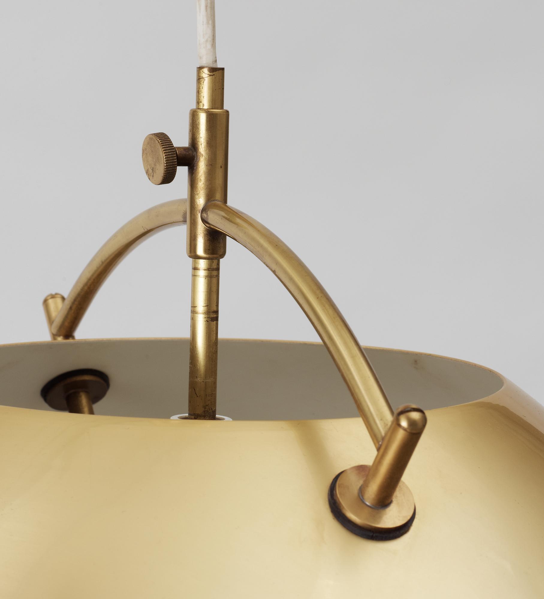 A Hans J Wegner brass hanging lamp by Louis Poulsen, Denmark.