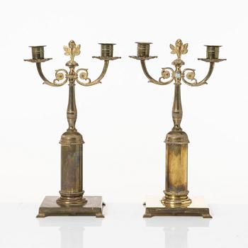 Candle holders, a pair of brass, Empire style, 20th century.