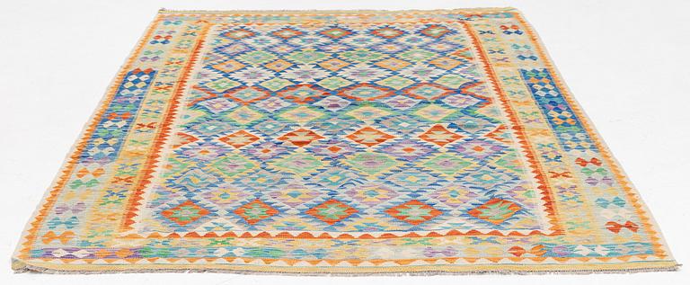 A Kelim carpet, c. 292 x 210 cm.