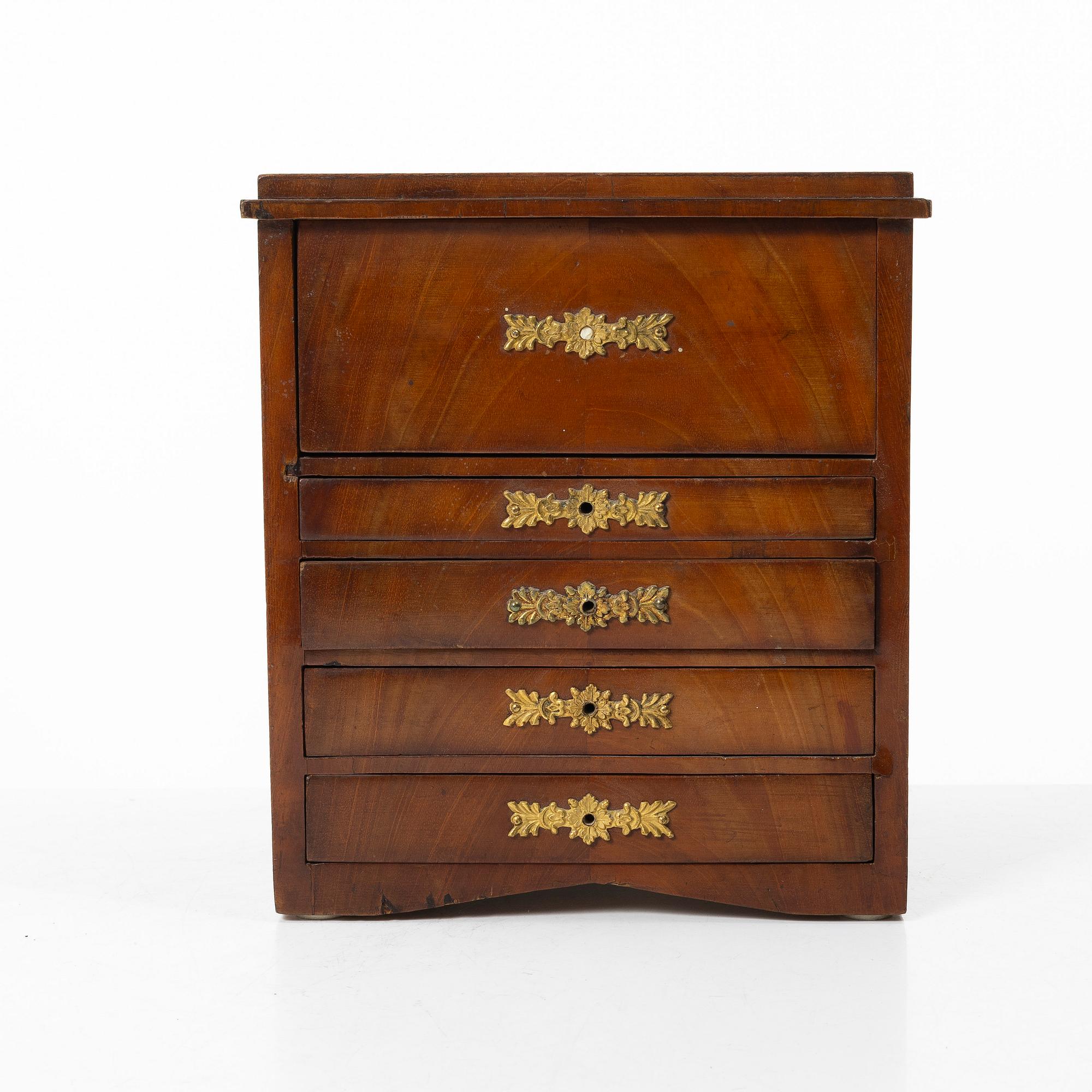A Swedish Empire mahogany minature commode, first part 19th century.