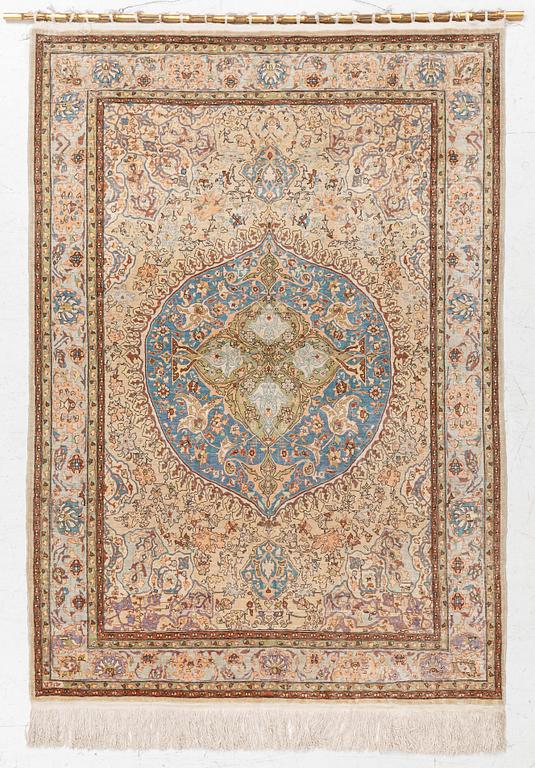 An oriental, silk rug, signed, c. 175 x 125 cm.