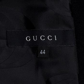 GUCCI, a black wool blend coat.