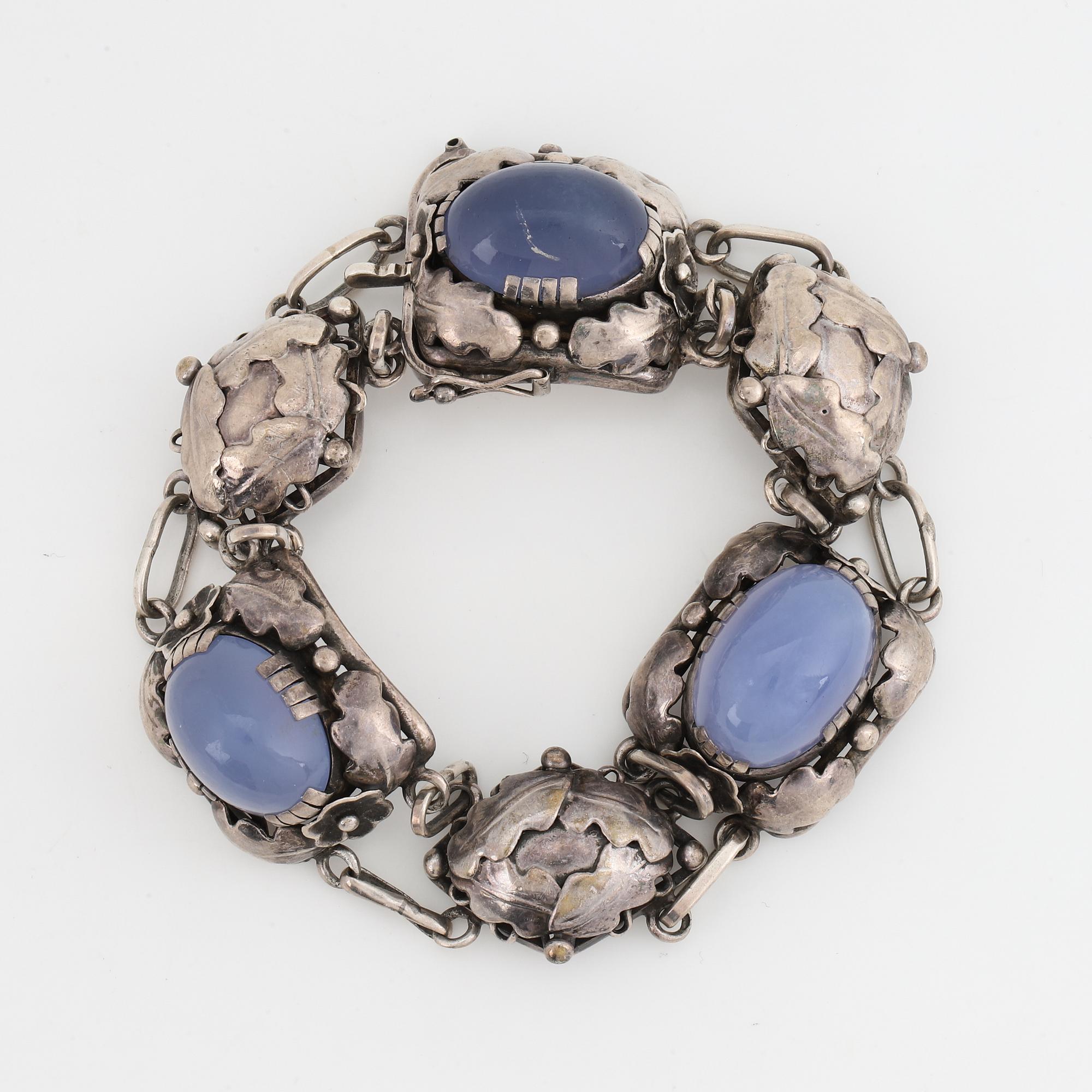 Bracelet, silver and cabochonslipade blue chalcedony, Gussi Smycken AB, Malmö, 1951.